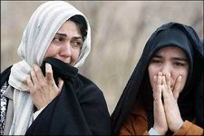 Iranian women cry after losing family members in a strong earthquake in southeastern Iran, February 22, 2005.