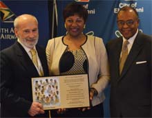 Ms. Nandi Mandela receiving IIPT Plaque from Lou D'Amore and Timothy Marshall