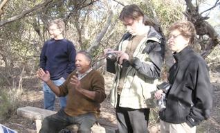 An example of Reconciliation Tourism  Neville Gollan of Camp Coorong (seated in center) leading a small group of tourists in Coorong National Park, South Australia.